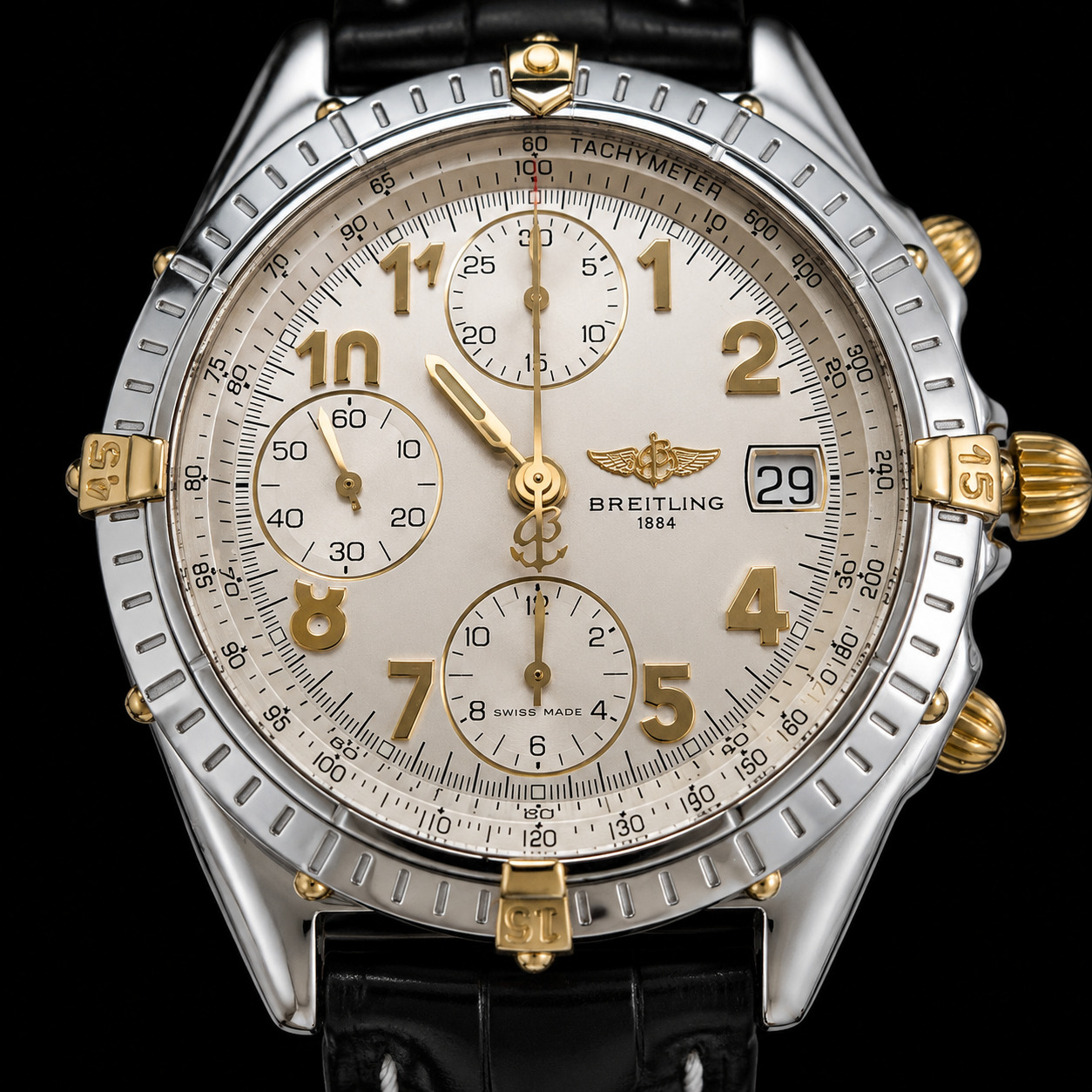 Breitling Chronomat dial showing date display — date mechanism begins engaging around 10:45pm