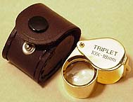 10x triplet loupe in gold case with brown leather pouch