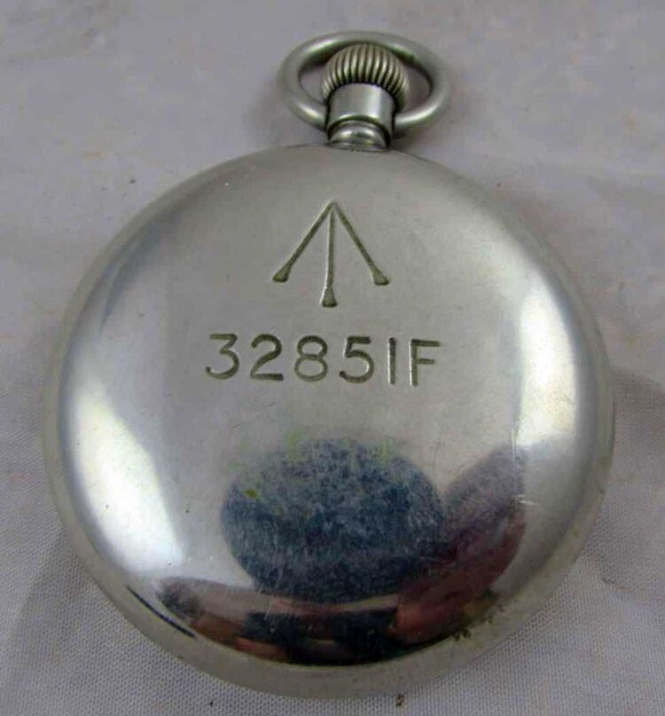 British military pocket watch caseback showing broad arrow mark and stores number 32851F