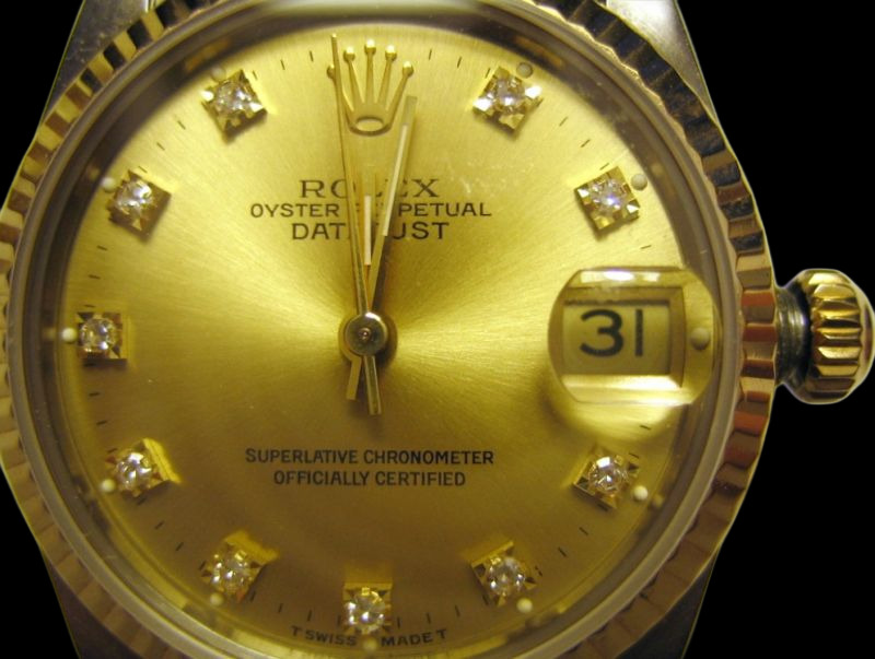 Rolex Datejust showing the crown in setting position — date changes instantaneously at midnight
