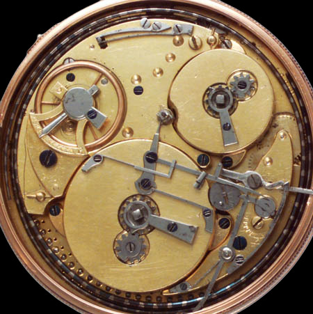 Movement of a Swiss musical pocket watch — pinned cylinder (centre), steel comb (lower left), fan-fly governor and balance wheel (right) visible on the back plate