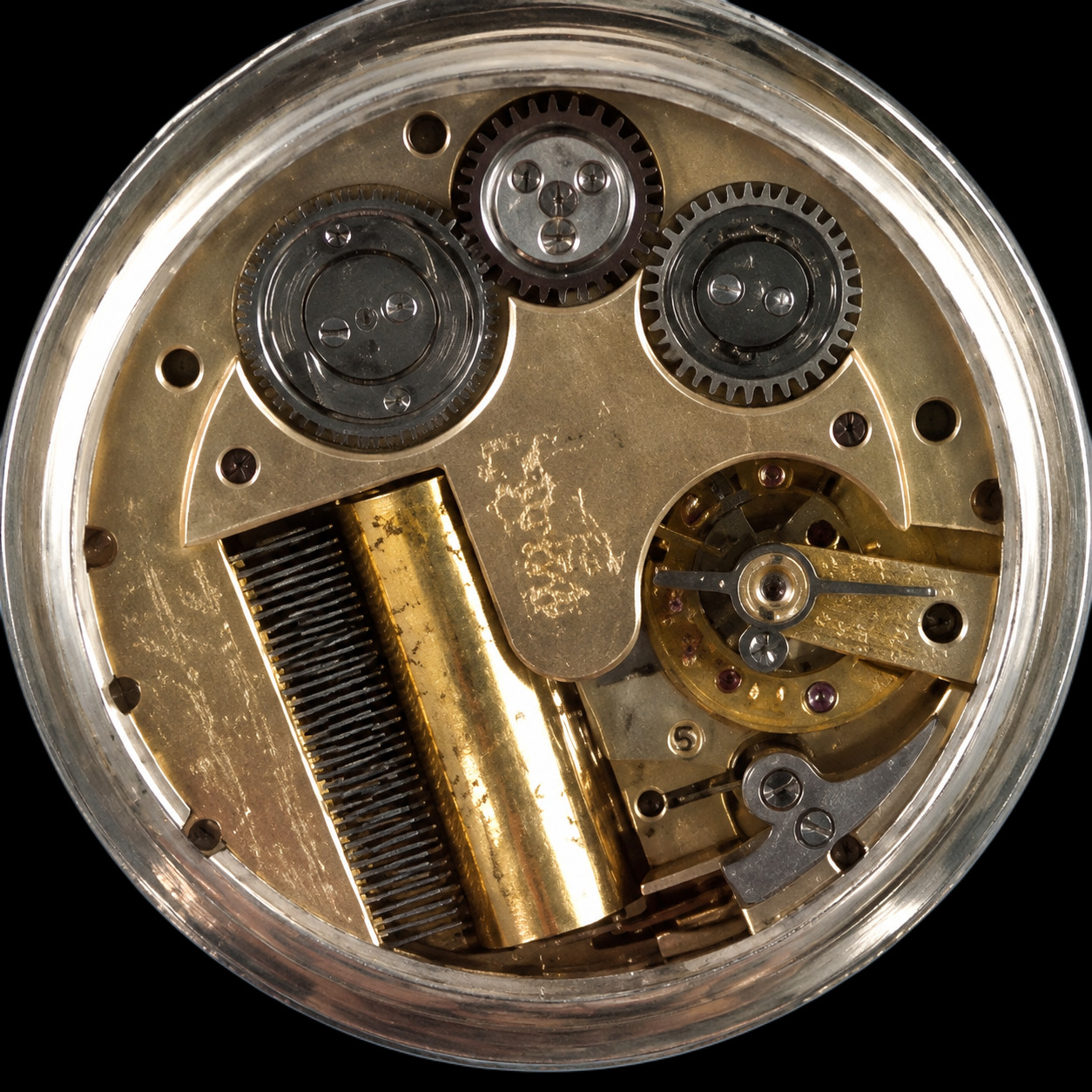 Silver-cased Swiss musical pocket watch movement — steel comb lower left, pinned brass cylinder centre, fan-fly governor and balance wheel right